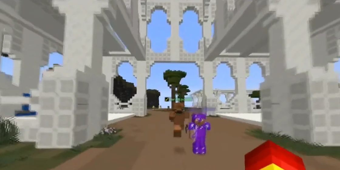 A player in purple armour running under SweMine's white arches